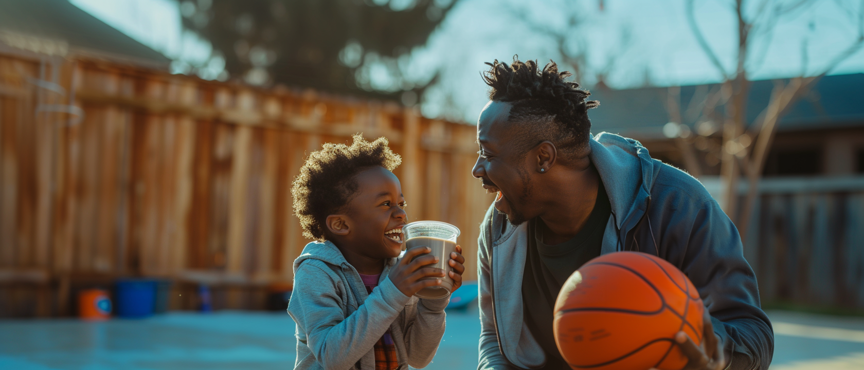 Happy Father and son playing basketball drinking FODmaps Chocolate Shake